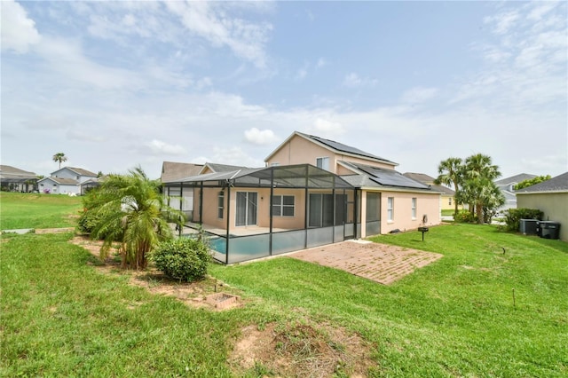 831 Corvina Dr, Davenport, FL 33897 - rear view of house featuring a patio area, an outdoor pool, a yard, and stucco siding