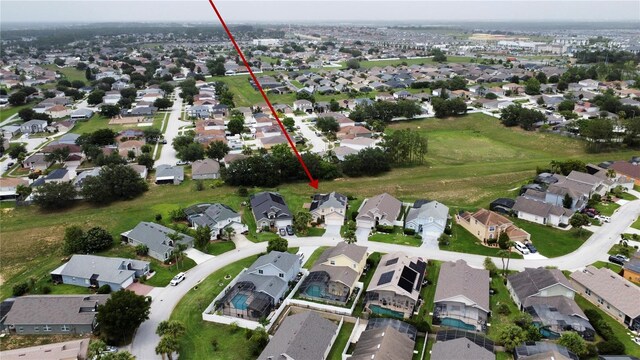 831 Corvina Dr, Davenport, FL 33897 - aerial view of property and surrounding area featuring nearby suburban area