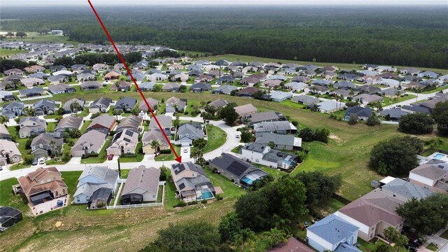 831 Corvina Dr, Davenport, FL 33897 - aerial view of property and surrounding area featuring nearby suburban area
