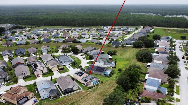 831 Corvina Dr, Davenport, FL 33897 - aerial view of property's location featuring a heavily wooded area and nearby suburban area