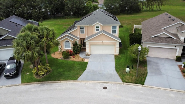 831 Corvina Dr, Davenport, FL 33897 - view of front of property with concrete driveway, a garage, stucco siding, and a front lawn