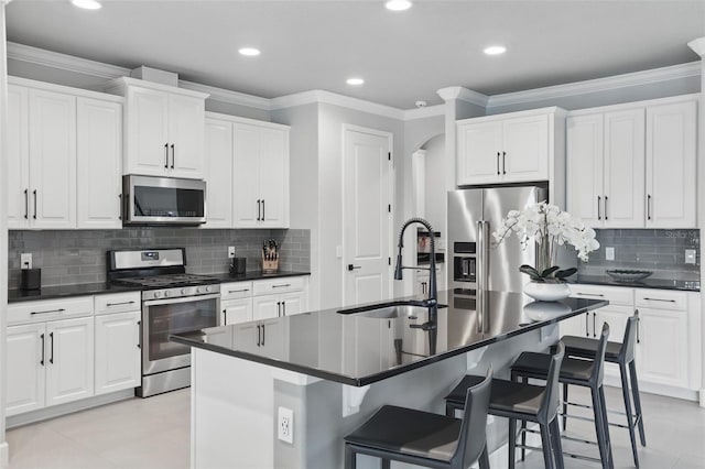 3222 Casterton Dr, Melbourne, FL 32940 - kitchen with stainless steel appliances, a sink, dark countertops, ornamental molding, and recessed lighting