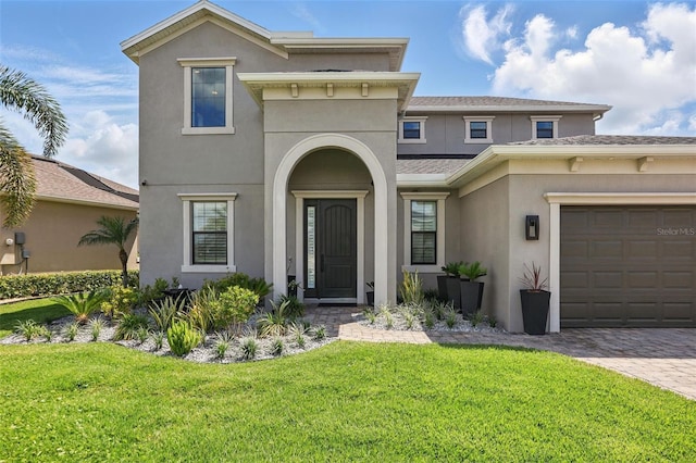 3222 Casterton Dr, Melbourne, FL 32940 - view of front of property with stucco siding, a front lawn, a garage, and driveway
