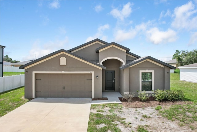 257 Fig Ct, Kissimmee, FL 34759 - ranch-style home featuring a garage, stucco siding, and concrete driveway