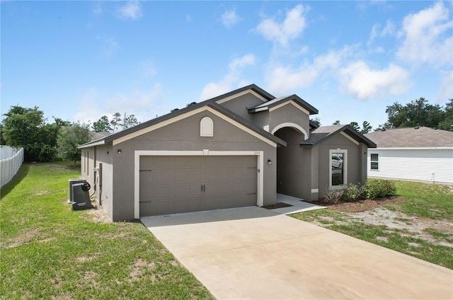 257 Fig Ct, Kissimmee, FL 34759 - single story home featuring stucco siding, a garage, and concrete driveway
