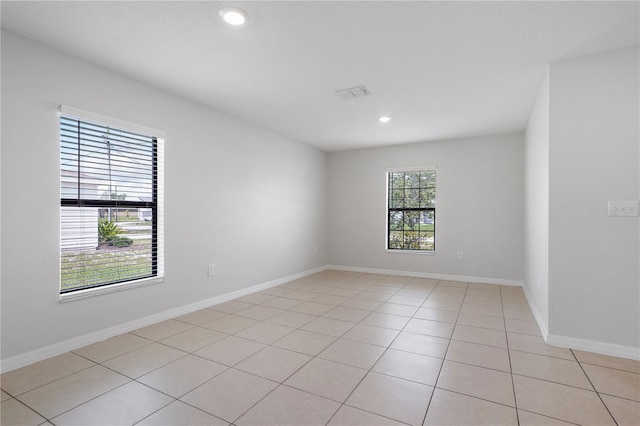 257 Fig Ct, Kissimmee, FL 34759 - spare room with light tile patterned flooring and recessed lighting