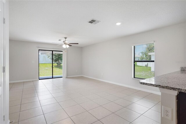 257 Fig Ct, Kissimmee, FL 34759 - spare room featuring a ceiling fan, light tile patterned floors, and recessed lighting