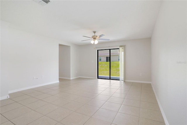 257 Fig Ct, Kissimmee, FL 34759 - empty room with a ceiling fan and light tile patterned floors