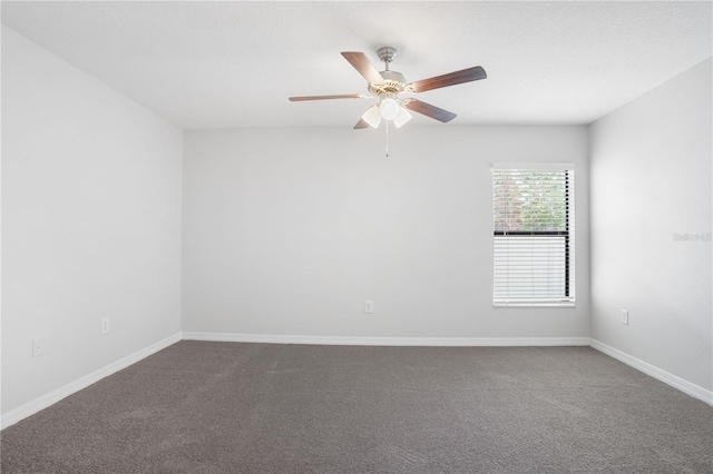257 Fig Ct, Kissimmee, FL 34759 - unfurnished room with dark colored carpet and a ceiling fan