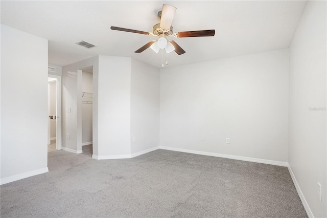 257 Fig Ct, Kissimmee, FL 34759 - unfurnished room with light colored carpet and a ceiling fan