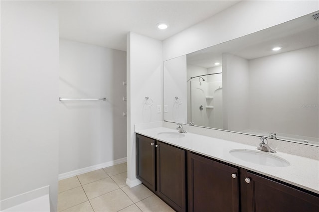 257 Fig Ct, Kissimmee, FL 34759 - bathroom featuring tile patterned floors, double vanity, a shower, and recessed lighting