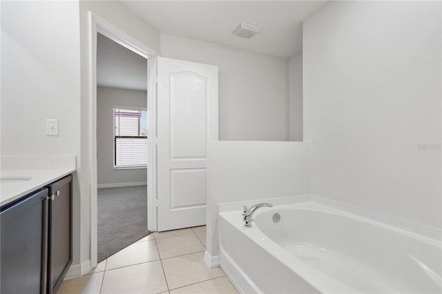 257 Fig Ct, Kissimmee, FL 34759 - full bathroom with a bath, vanity, and tile patterned floors