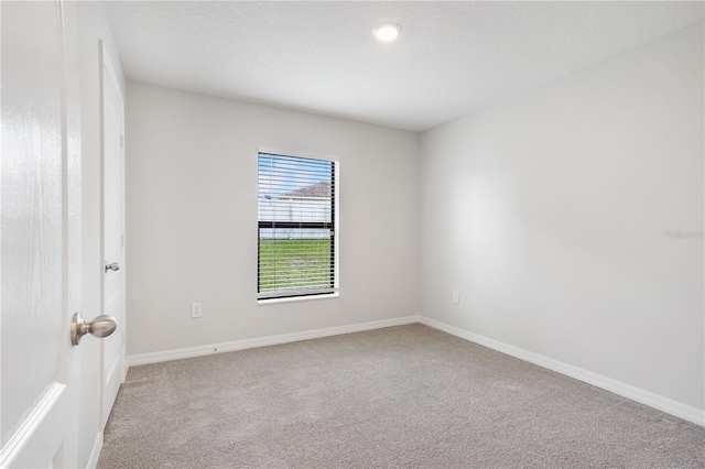257 Fig Ct, Kissimmee, FL 34759 - unfurnished room with light carpet and baseboards