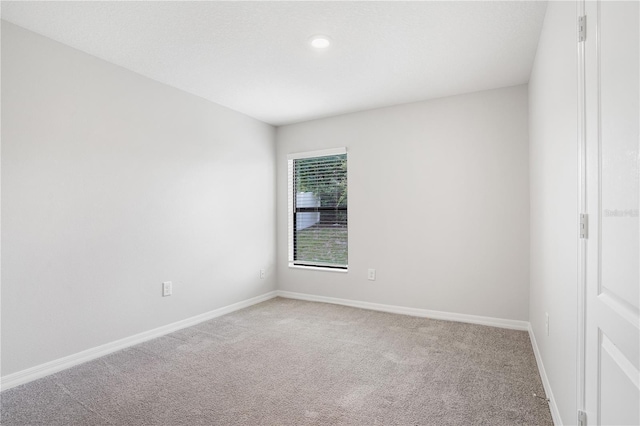 257 Fig Ct, Kissimmee, FL 34759 - unfurnished room featuring light carpet and recessed lighting