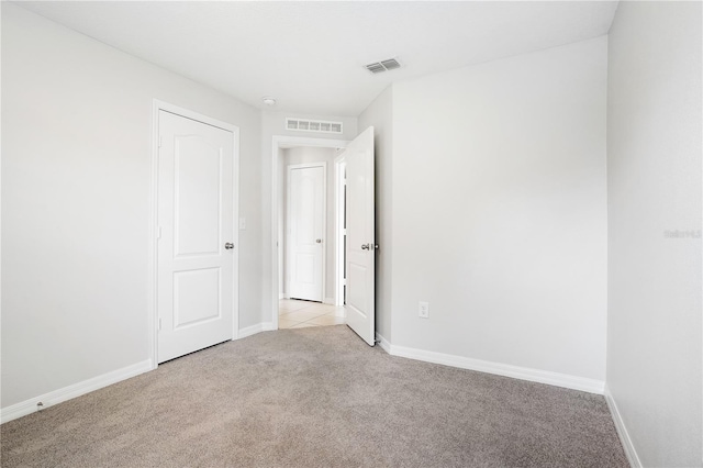 257 Fig Ct, Kissimmee, FL 34759 - unfurnished room with light carpet and baseboards