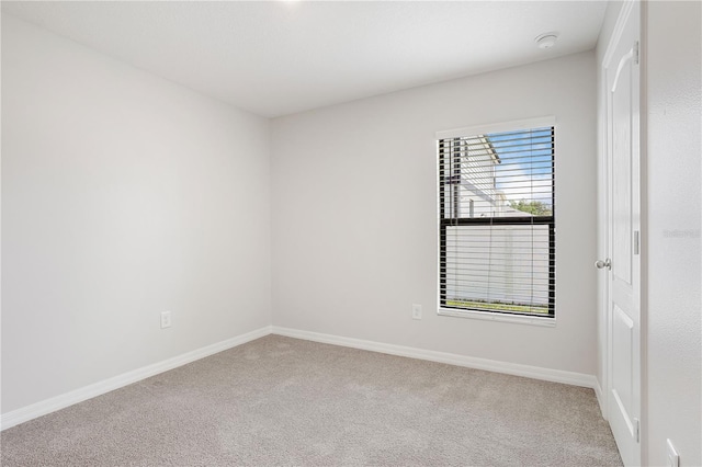 257 Fig Ct, Kissimmee, FL 34759 - spare room with carpet flooring and a smoke detector