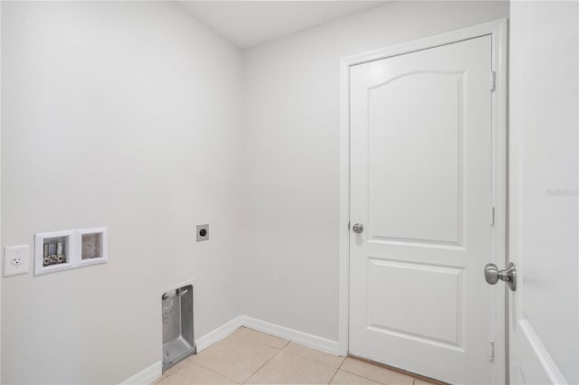 257 Fig Ct, Kissimmee, FL 34759 - laundry area with hookup for an electric dryer, washer hookup, and light tile patterned flooring