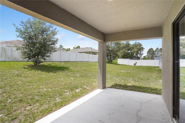 257 Fig Ct, Kissimmee, FL 34759 - fenced backyard with a patio area
