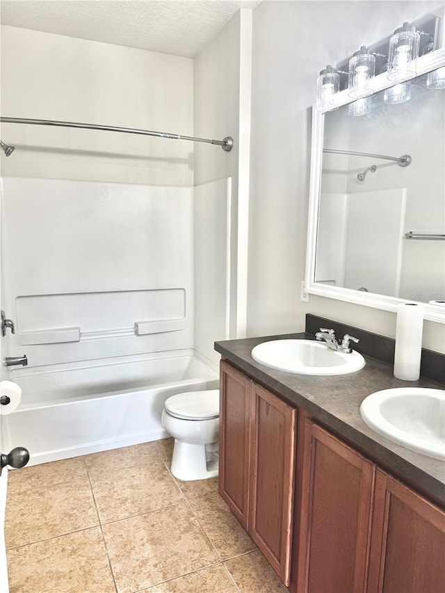 535 Aeolian Dr, New Smyrna Beach, FL 32168 - full bath with shower / bath combination, double vanity, tile patterned floors, and a textured ceiling