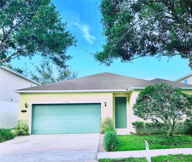 535 Aeolian Dr, New Smyrna Beach, FL 32168 - ranch-style house featuring driveway, stucco siding, and an attached garage