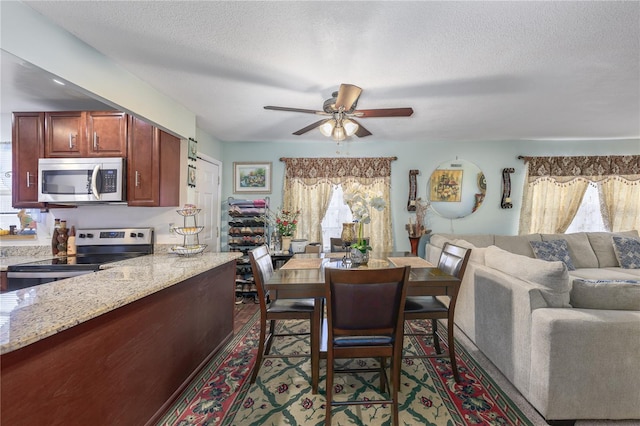 1000 S Semoran Blvd Unit 604, Winter Park, FL 32792 - dining area with a ceiling fan and a textured ceiling