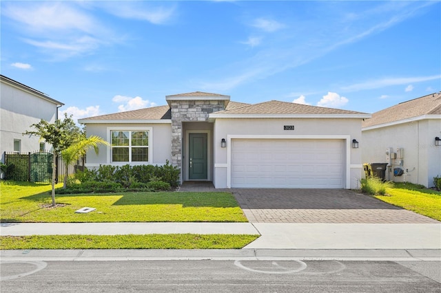 3123 Camden Way, Davenport, FL 33837 - view of front of home featuring stucco siding, a garage, and driveway