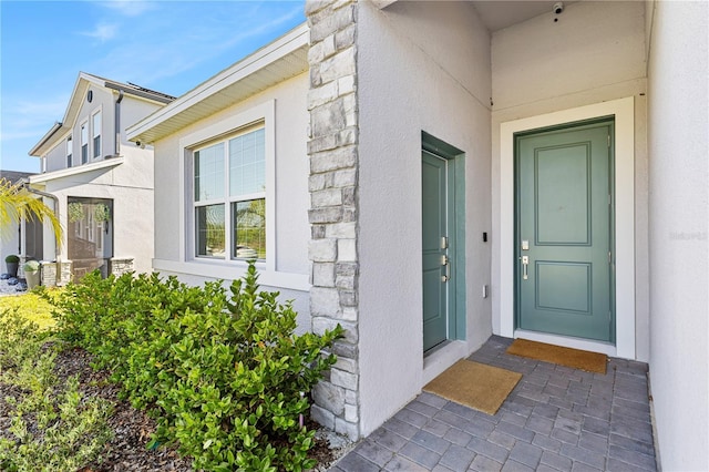 3123 Camden Way, Davenport, FL 33837 - view of exterior entry featuring stone siding and stucco siding