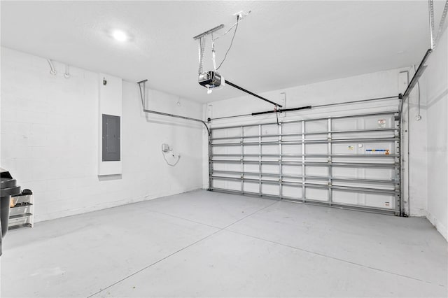 3123 Camden Way, Davenport, FL 33837 - garage with electric panel, a garage door opener, and concrete block wall