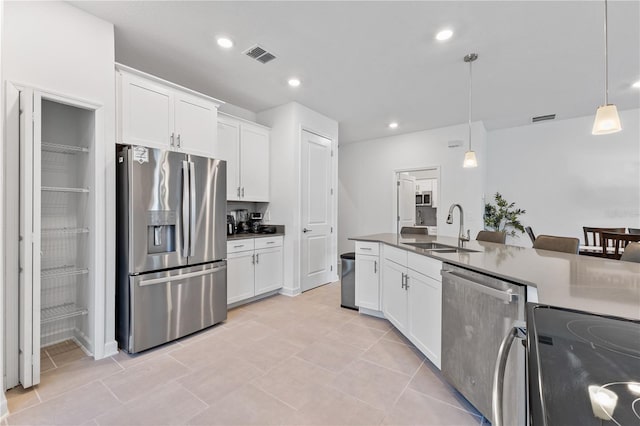 3123 Camden Way, Davenport, FL 33837 - kitchen featuring stainless steel appliances, a sink, decorative light fixtures, white cabinetry, and recessed lighting