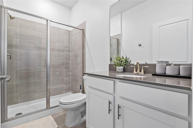 3123 Camden Way, Davenport, FL 33837 - full bathroom with vanity, toilet, a stall shower, and tile patterned flooring
