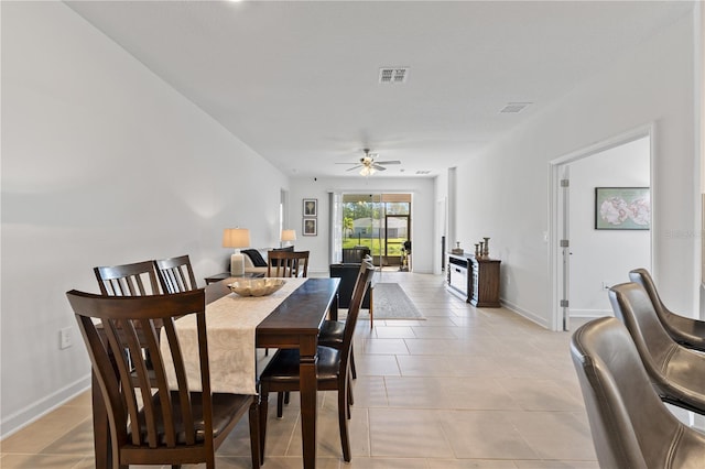 3123 Camden Way, Davenport, FL 33837 - dining room with light tile patterned floors, ceiling fan, and baseboards