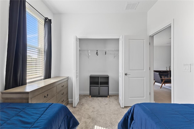 3123 Camden Way, Davenport, FL 33837 - bedroom featuring light colored carpet, a closet, and baseboards