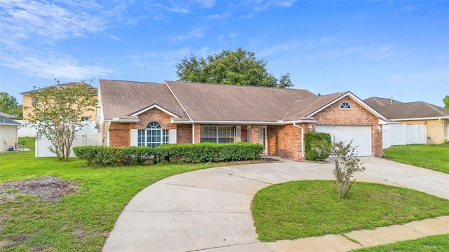 40 Hollow Pine Dr, Debary, FL 32713 - single story home featuring brick siding, driveway, a shingled roof, and a garage