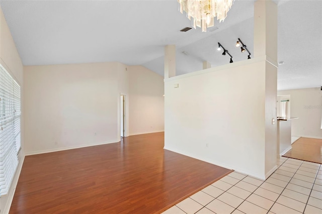 40 Hollow Pine Dr, Debary, FL 32713 - unfurnished room featuring vaulted ceiling, light wood-style flooring, and a chandelier