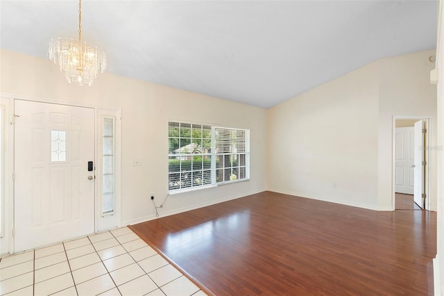 40 Hollow Pine Dr, Debary, FL 32713 - entryway featuring a chandelier, vaulted ceiling, and wood finished floors