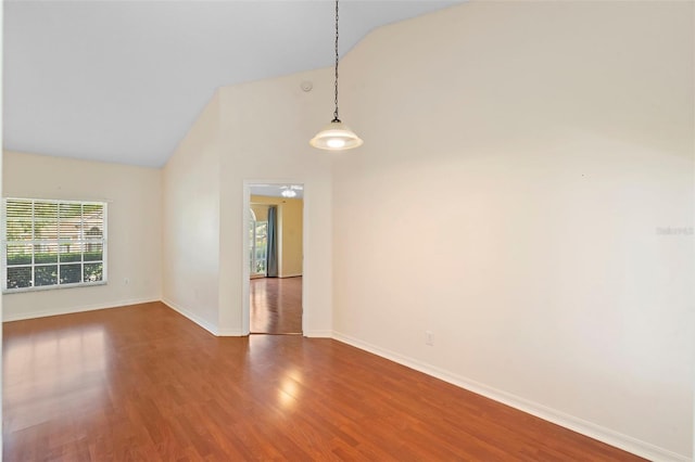 40 Hollow Pine Dr, Debary, FL 32713 - empty room featuring healthy amount of natural light, wood finished floors, and high vaulted ceiling