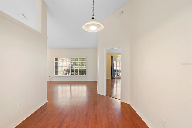 40 Hollow Pine Dr, Debary, FL 32713 - spare room featuring plenty of natural light, wood finished floors, and high vaulted ceiling