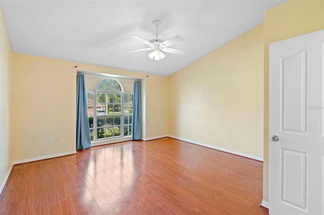 40 Hollow Pine Dr, Debary, FL 32713 - empty room with lofted ceiling, wood finished floors, and a ceiling fan