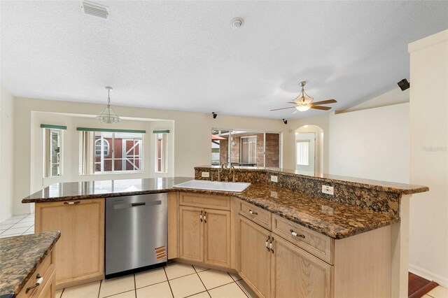 40 Hollow Pine Dr, Debary, FL 32713 - kitchen featuring stainless steel dishwasher, light brown cabinets, ceiling fan, dark stone counters, and lofted ceiling