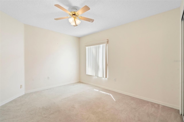 40 Hollow Pine Dr, Debary, FL 32713 - spare room with light carpet, ceiling fan, and a textured ceiling