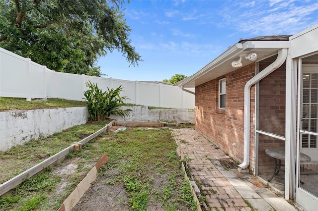 40 Hollow Pine Dr, Debary, FL 32713 - fenced backyard with a garden