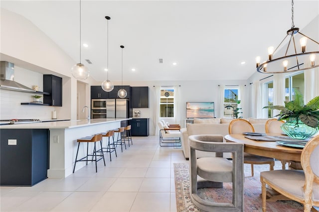 744 Curly Locks Loop, Apopka, FL 32703 - dining room featuring lofted ceiling, a chandelier, light tile patterned flooring, and recessed lighting