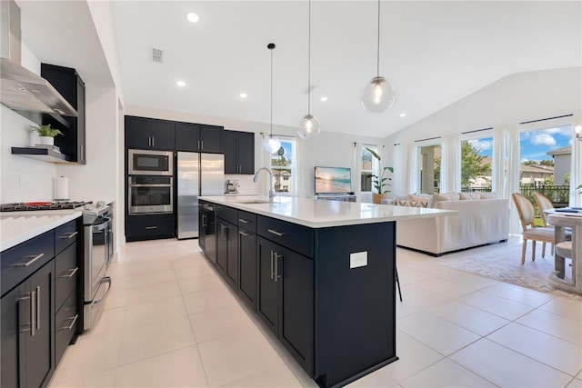 744 Curly Locks Loop, Apopka, FL 32703 - kitchen featuring stainless steel appliances, dark cabinetry, lofted ceiling, light countertops, and open shelves