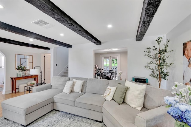 322 Cornell Dr, Lake Worth, FL 33460 - living area with beamed ceiling, stairs, recessed lighting, light wood-type flooring, and arched walkways