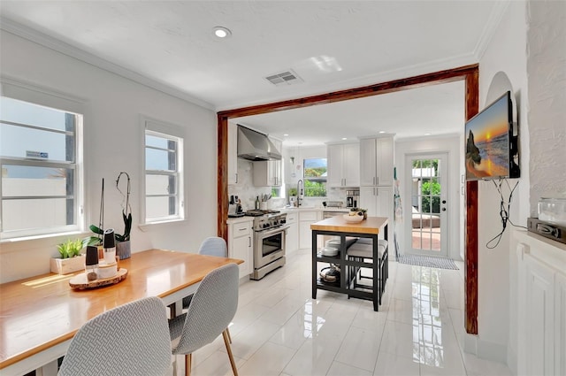 322 Cornell Dr, Lake Worth, FL 33460 - dining space featuring recessed lighting, light tile patterned floors, and ornamental molding
