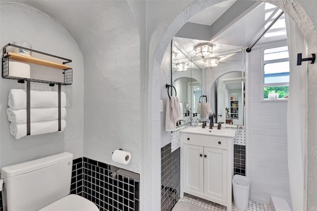 322 Cornell Dr, Lake Worth, FL 33460 - full bathroom with vanity, tile walls, and a tile shower