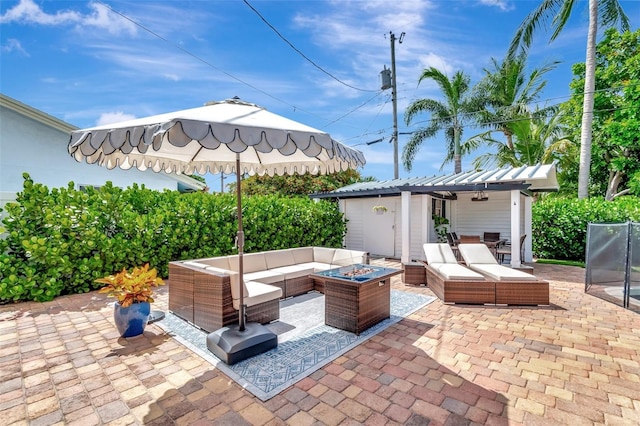 322 Cornell Dr, Lake Worth, FL 33460 - view of patio with an outdoor living space with a fire pit and an outbuilding
