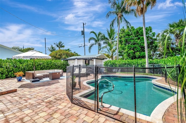 322 Cornell Dr, Lake Worth, FL 33460 - view of swimming pool featuring an outdoor living space, a patio area, and a fenced backyard