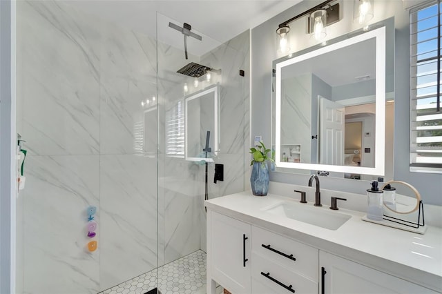 322 Cornell Dr, Lake Worth, FL 33460 - bathroom featuring a marble finish shower, vanity, and plenty of natural light
