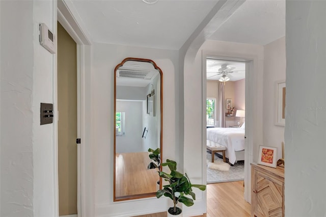 322 Cornell Dr, Lake Worth, FL 33460 - hallway with light wood-style floors and arched walkways
